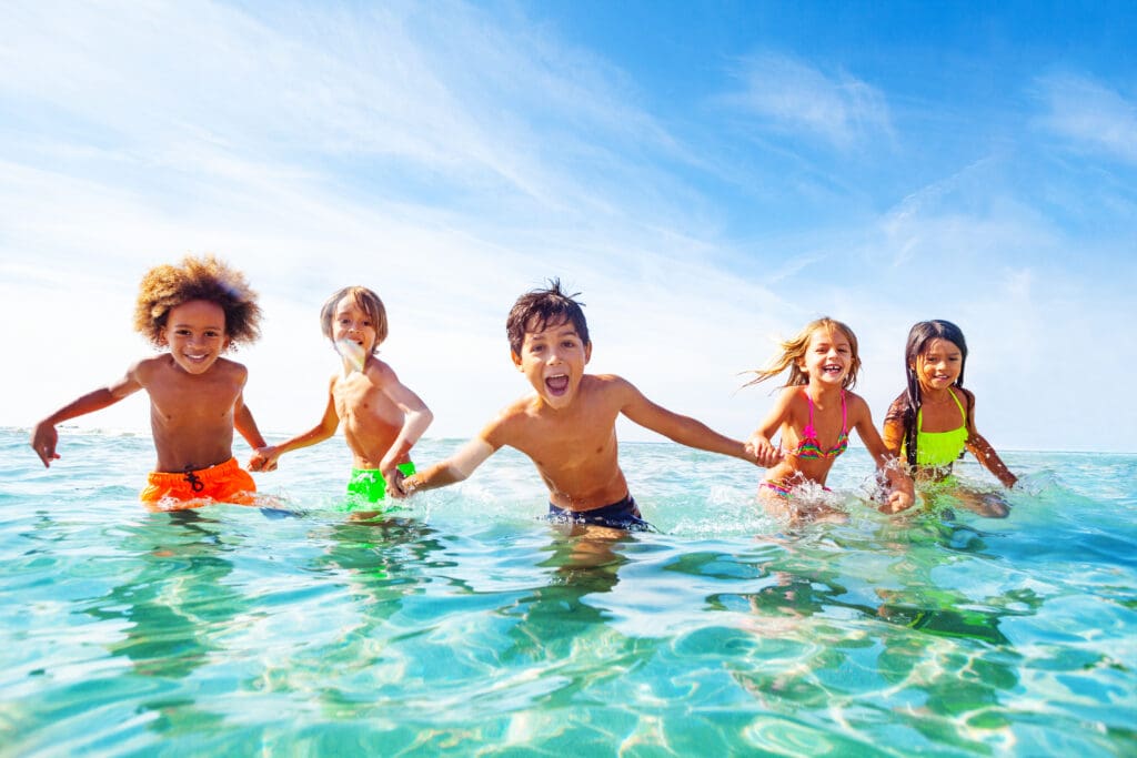 Kids laughing and playing in water at the seaside – Le Sentier des Pins, Ramatuelle