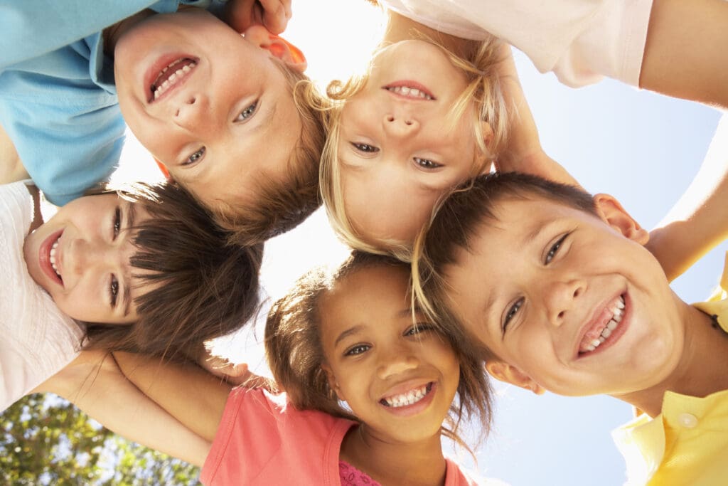 Group Of Children Looking Down Into Camera — Holiday camps