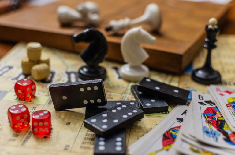 Collection of classic board games on a vintage map – Le 1850, Le Sentier des Pins